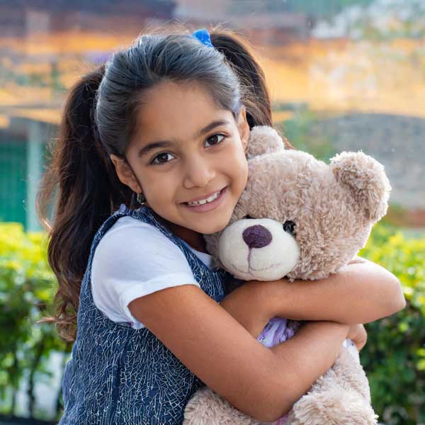 young girl with her favorite stuffed toy